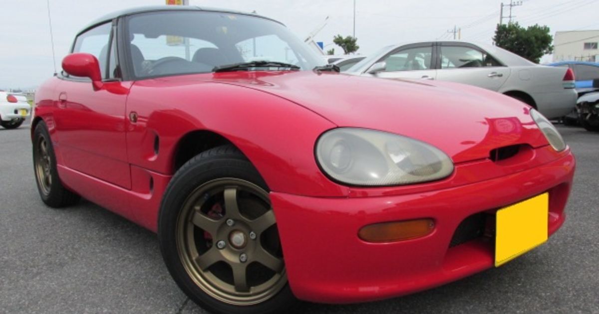 レイズのホイールを履いてるスマートな赤の中古車 スズキ カプチーノ 
