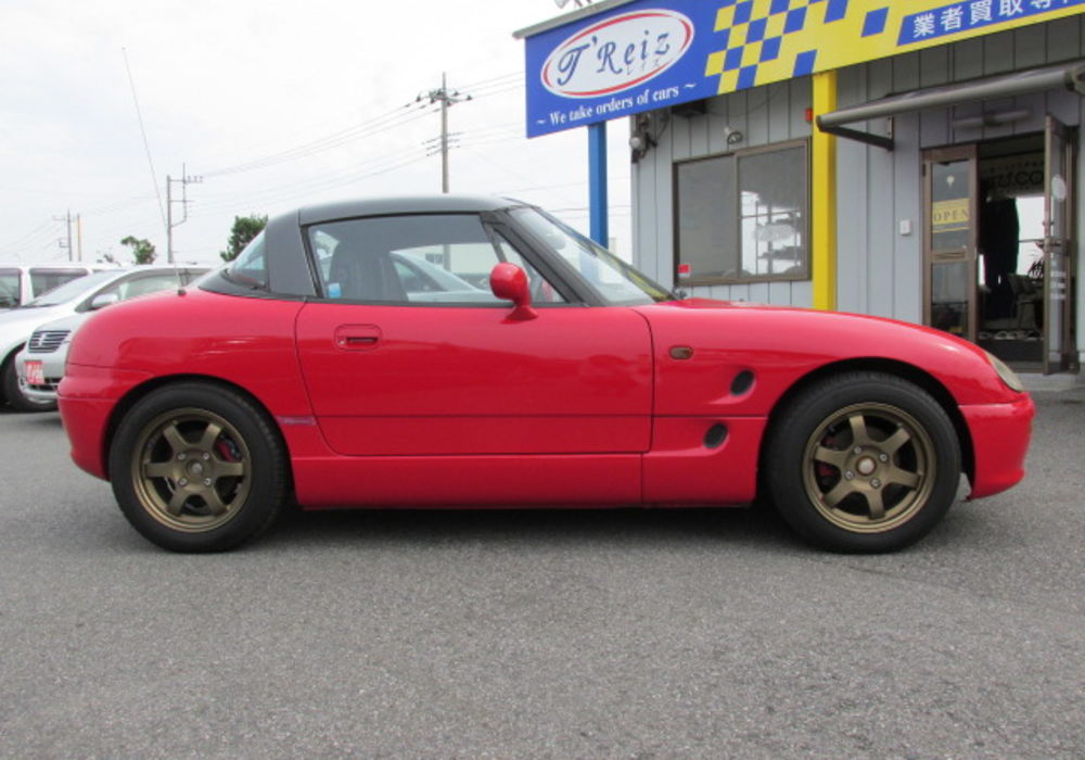 レイズのホイールを履いてるスマートな赤の中古車 スズキ カプチーノ 